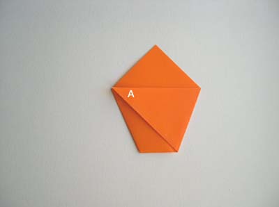 piece flipped over, bottom corner folded upwards
